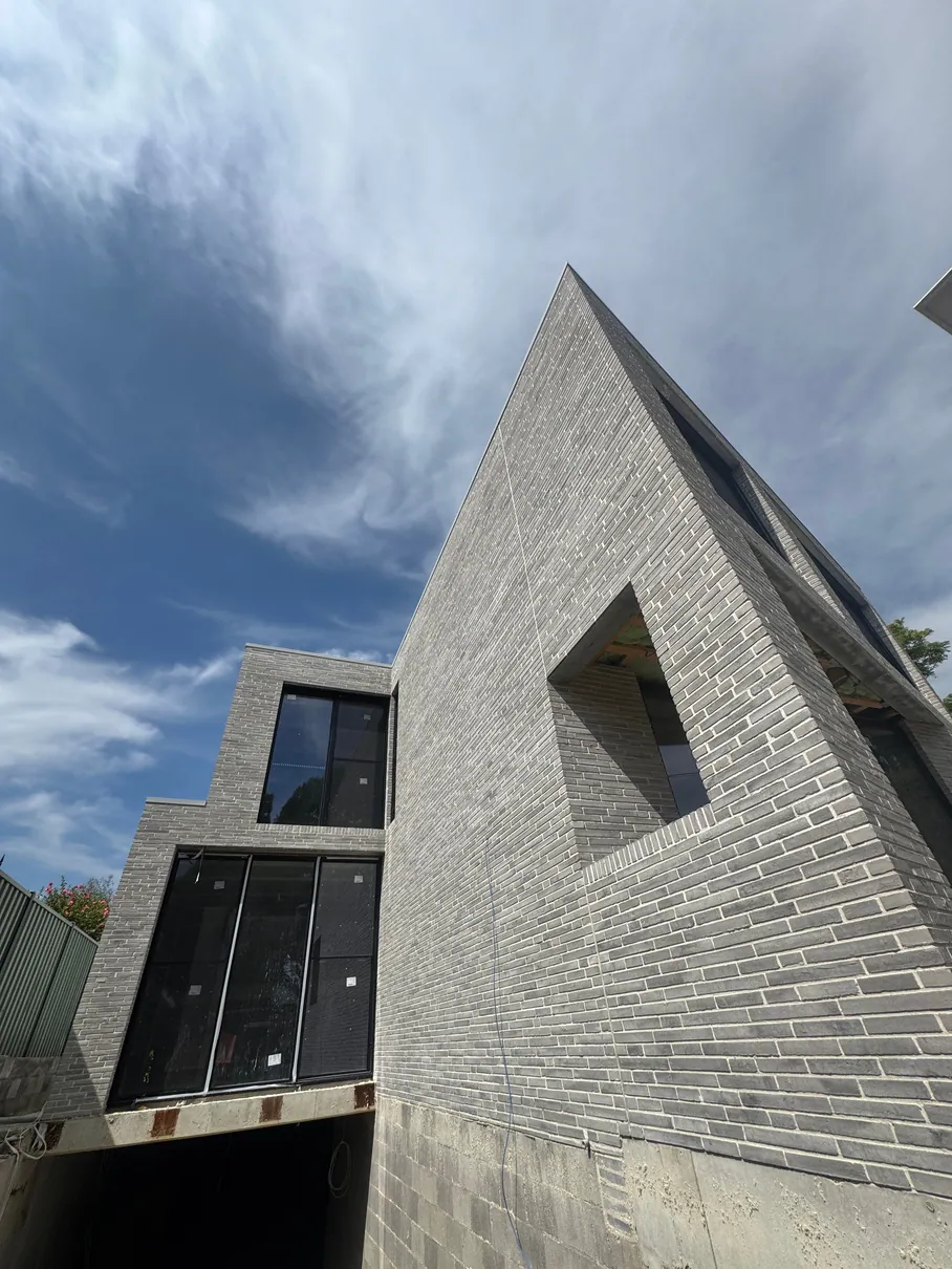 Angular grey brick feature facade on an architect designed home