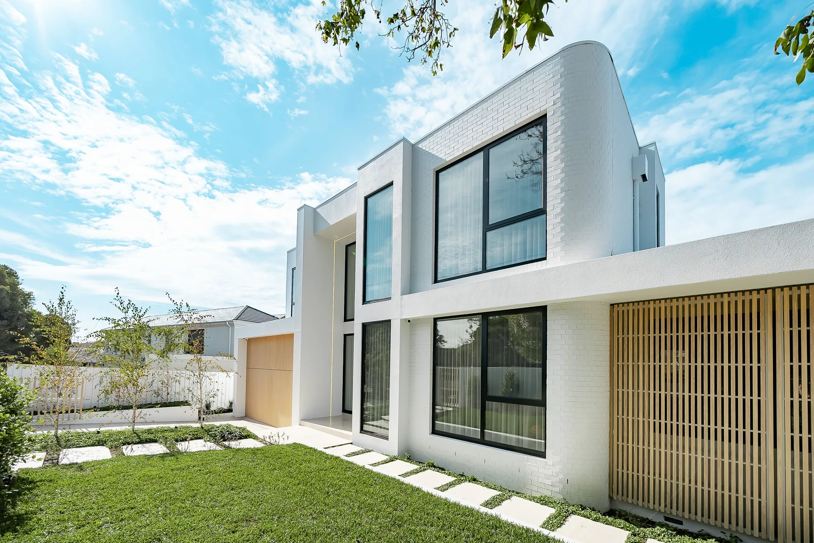 Curved white brick facade on an architect designed home